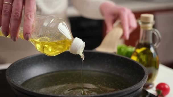 Woman Pours Vegetable Oil Frying Pan Induction Stove — Vídeo de Stock