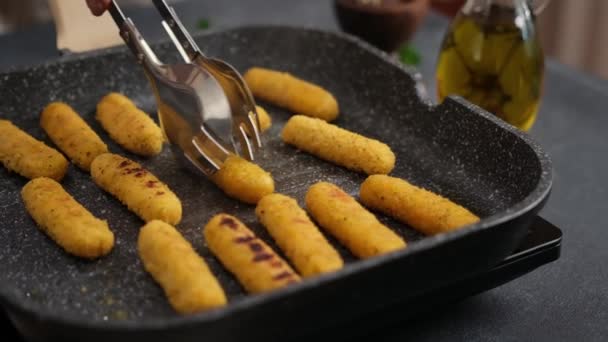 Woman Puts Cheese Sticks Hot Oiled Grill Frying Pan — Video Stock