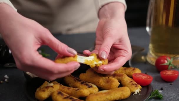 Woman Rips Cheese Fried Mozzarella Stick Melted Cheese Flows Out — Stock video