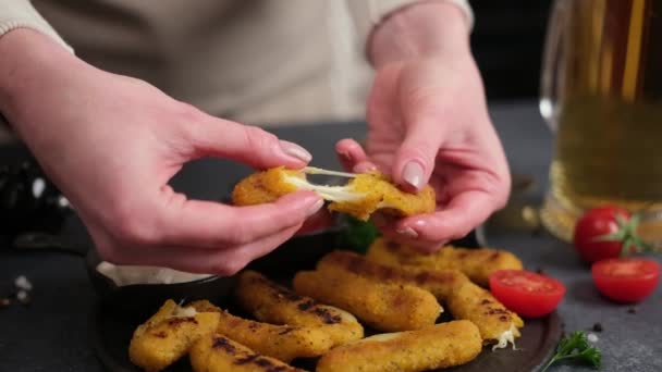 Woman Rips Cheese Fried Mozzarella Stick Melted Cheese Flows Out — Stockvideo