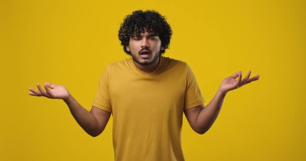 Frustrated Young Indian Man Raising His Hands Shrugging His Shoulders — Stock Video