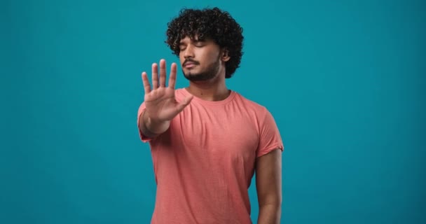 Serious Young Indian Man Shows Open Palms Asking Stop Calm — Vídeo de stock
