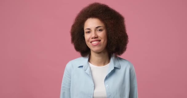 Smiling Attractive African American Woman Winks Looking Camera Standing Pink — Vídeos de Stock