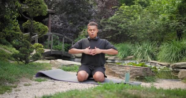 Calm Mindful Young African American Man Meditating Doing Exercise Practicing — Stock Video