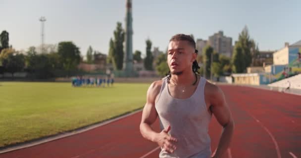 Young African American Runner Athlete Jogging Stadium Slow Motion — Stock Video