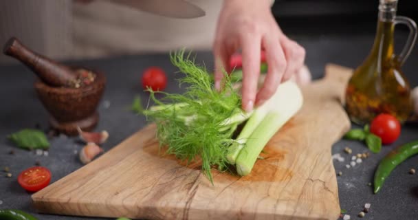 Woman Cutting Fennel Greens Wooden Cutting Board Dci — Stock Video
