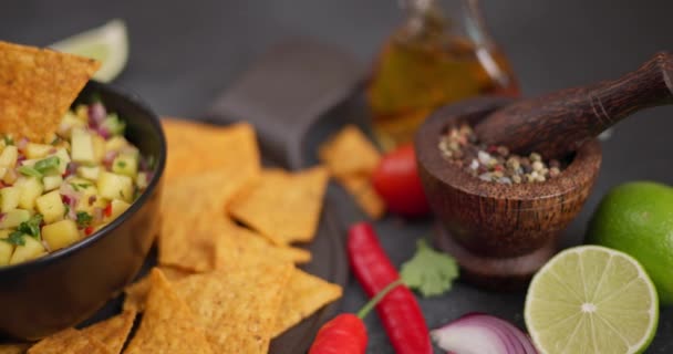 Freshly Made Mango Salsa Black Ceramic Bowl Tortilla Chips Dark — Stock Video