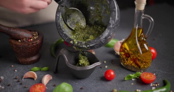 Woman Pours Green Basil Capers Sauce Black Ceramic Gravy Boat — Stock Video