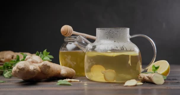 Steaming Glass Kettle Organic Herbal Tea Ginger Lemon — Stock Video