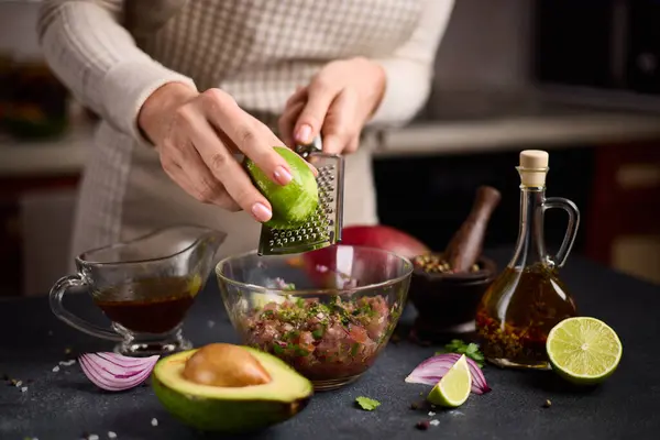 Woman Grates Lime Zest Chopped Tuna Cilantro Onion Glass Bowl Stockbild