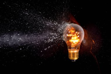 lit bulb hit by projectile explosion and fragments