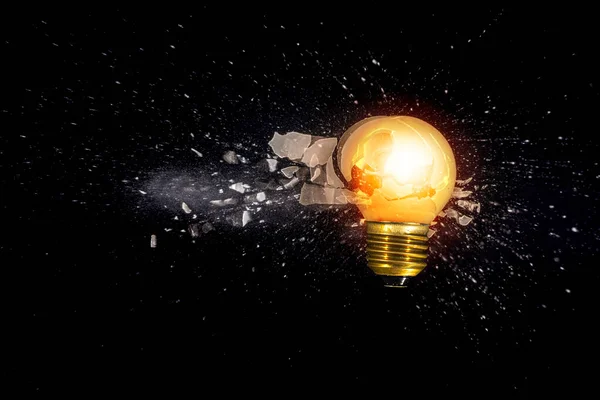 Small Light Bulb Exploding Black Background — Stock Photo, Image
