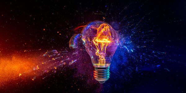 High-speed photography of a bulb breaking on a black background