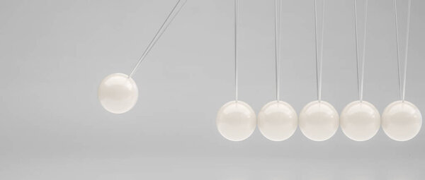 Колыбель Ньютона показывает причину и эффект на белом фоне шаров 3d