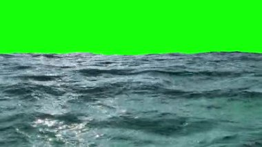 Gerçekçi okyanus dalgaları yeşil bir ekranda yavaşça hareket ediyor.