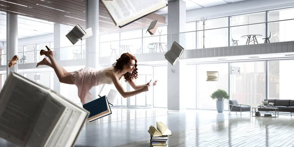 Young Woman Levitates While Reading Book Mixed Media — Stock Photo, Image