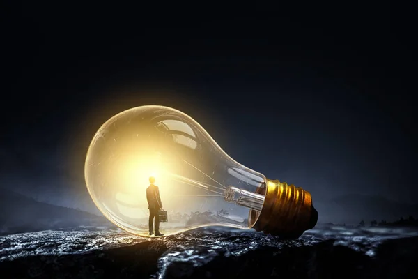 Huge Electric Light Bulb Glowing Darkness Mixed Media — Stock Photo, Image