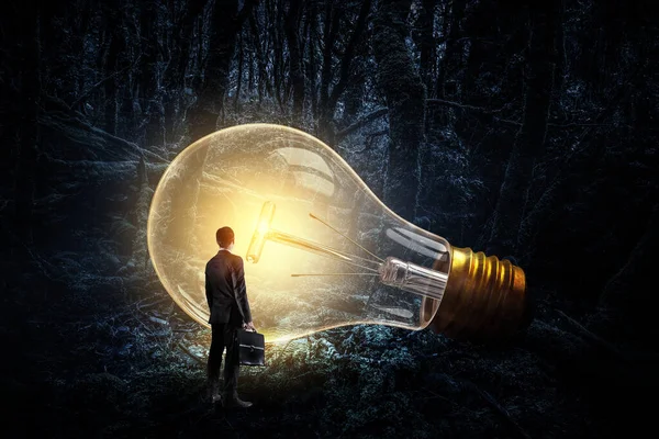 Huge Electric Light Bulb Glowing Darkness Mixed Media — Stock Photo, Image