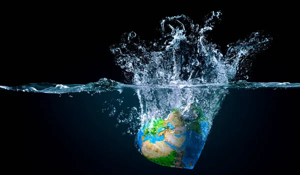 Earth globe in water. Mixed media