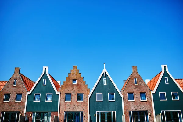 Colorful houses in marine park in Volendam. Typical Dutch landscape in North Holland, the Netherlands.