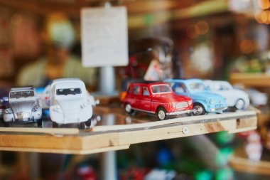 Various vintage car toys on a flea market in Paris, France