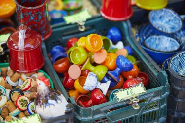 Colorful clay crockery on a farmer market in Cucuron, Provence, France
