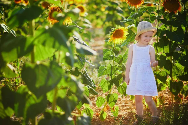 Adorable Year Old Girl White Dress Straw Hat Field Sunflowers — Stock fotografie