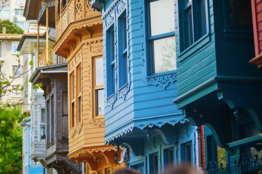 Colorful Ottoman wooden houses on streets of Kuzguncuk, a neighborhood in the Uskudar district on the Asian side of the Bosphorus in Istanbul, Turkey clipart