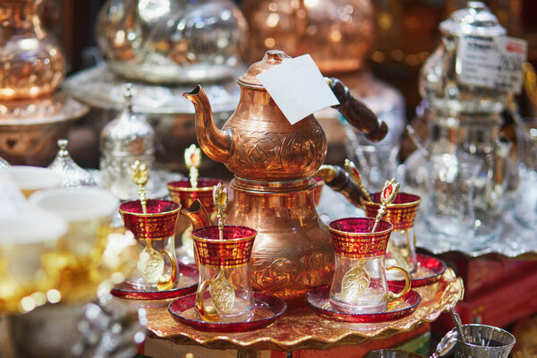 Beautiful tea set on Egyptian Bazaar or Spice Bazaar, one of the largest bazaars in Istanbul, Turkey. Market sells spices, sweets, jewellery, dried fruits and nuts