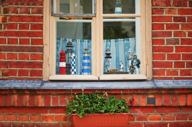 Beautiful window decoration in a house on Suomenlinna island, Helsinki, Finland clipart