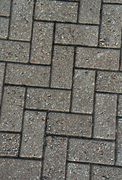 Traditional brick grey cobblestone surface.