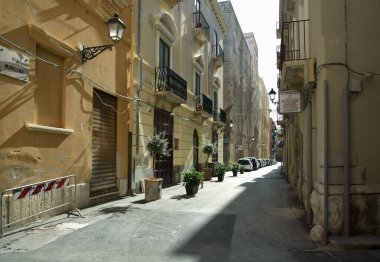 ITALY, TRAPANI-25 OCTOBER: Trapani is a city on the west coast of Sicily. View of the narrow street in Trapani on October 25, 2022, Trapani, Sicily.