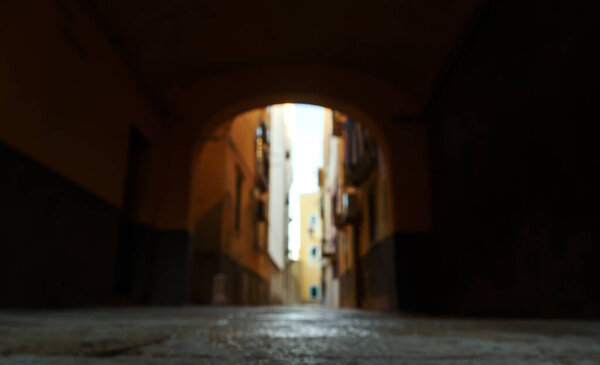 Defocused view of a narrow street in Trapani.