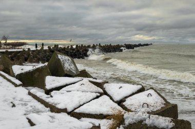 Wavy Baltic Sea at the northern pier in Liepaja. clipart