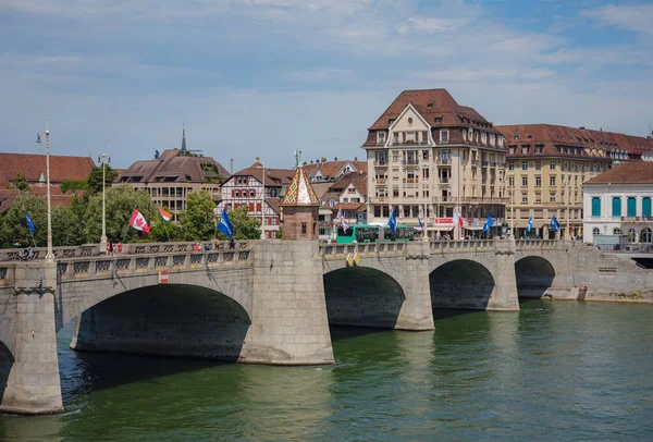 Stock image BASEL, SWITZERLAND, JULY 7, 2022: bridge Wetsteinbrucke over Rhine river and historical Buildings in the town. walk through old well-preserved city in Europe.