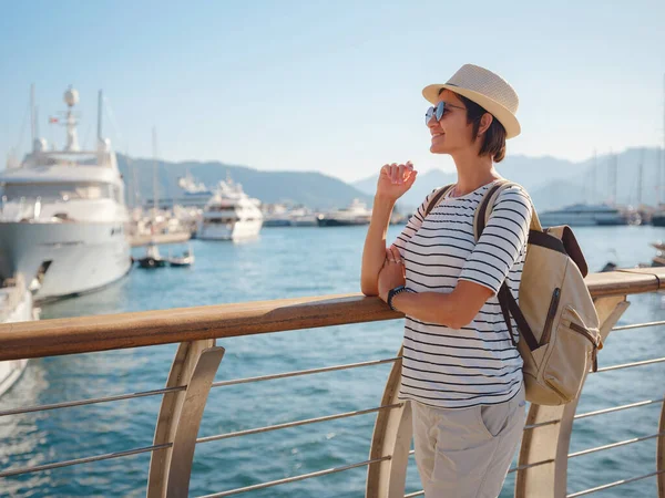 stock image Marmaris is resort town on Turkish Riviera, also known as Turquoise Coast. Marmaris is great place for sailing and diving. Asian woman with hat walking on pier in harbor.