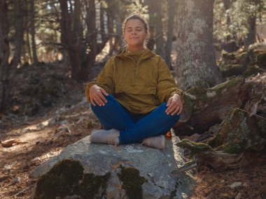 caucasian woman enjoys being in nature, beautiful forest in mountains. embracing fresh air and engaging in outdoor activities. Friluftsliv concept means spending as much time outdoors as possible