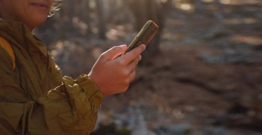 caucasian woman enjoys being in nature, beautiful forest in mountains. embracing fresh air and engaging in outdoor activities. Friluftsliv concept means spending as much time outdoors as possible