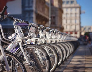 Vienna, Austria - August 9, 2022 : Rental bikes on the parking. traffic, city transport and people concept