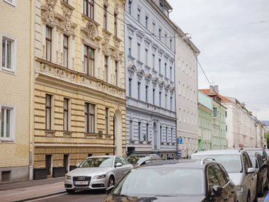 Linz, Austria - August 6, 2022 : View through the main street of the city. Linz is the third-largest city of Austria