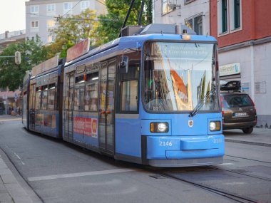 Munich, Germany - August 4, 2022 : public transport in the city. Munich Blue tram or tramway on the city street.