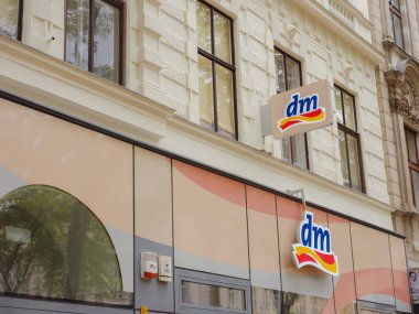 Vienna, Austria - August 7, 2022: Logo of dm store. dm-drogerie markt is a chain of retail stores that sells cosmetics, healthcare items, household products and health food.