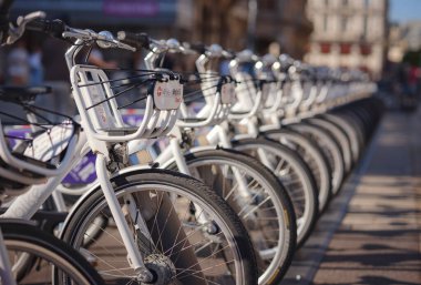 Vienna, Austria - August 9, 2022 : Rental bikes on the parking. traffic, city transport and people concept