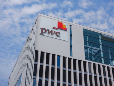 Munich, Germany - August 5, 2022: Facades of buildings PricewaterhouseCoopers GmbH. It is a German company based in Frankfurt am Main.