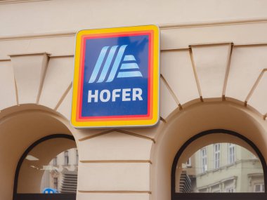 Vienna, Austria - August 8, 2022: Hofer Supermarkets logo in front of one of their retail places in Vienna. Hofer is the Austrian franchise of Aldi Sud, a German Discount Supermarket chain. clipart