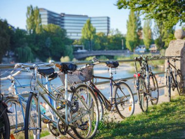 Munich, Germany - August 4, 2022 : bikes on the parking in city center. traffic, city transport and people concept