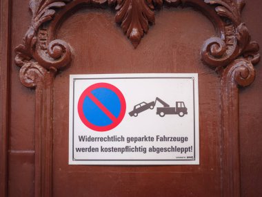 Munich, Germany - August 4, 2022 : a sign prohibiting parking near a building in the city, personal transport concept