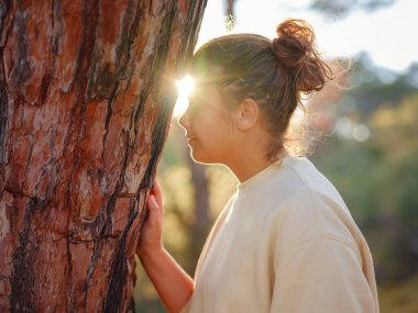 caucasian woman enjoys being in nature, beautiful forest in mountains. embracing fresh air and engaging in outdoor activities. Friluftsliv concept means spending as much time outdoors as possible