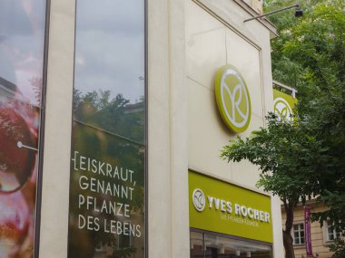 Vienna, Austria - August 7, 2022: Yves Rocher logo and text sign store on shop wall French beauty brand