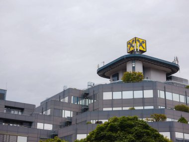 Linz, Austria - August 6, 2022: facade with logo of Raiffeisen Bank is one of the largest Austrian banking groups, cooperative bank. In addition to Austria, it operates in 14 other countries of Europe